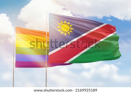 Sunny blue sky and flags of lgbt and namibia