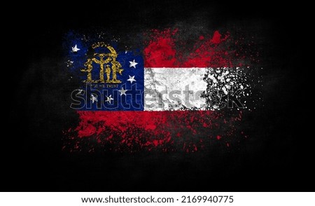 brush painted flag of State of Georgia isolated on black background