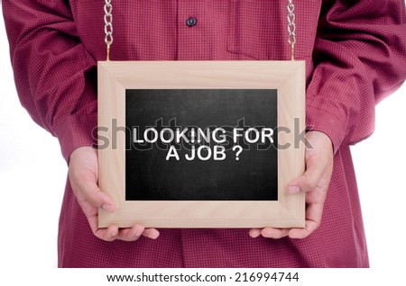 Executive holding a hanging frame with "LOOKING FOR A JOB" text