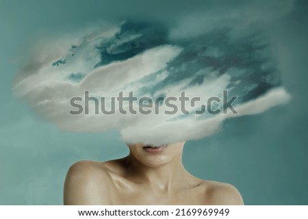 Woman head hidden by soft cloud on blue background, mental health, brain fog Royalty-Free Stock Photo #2169969949