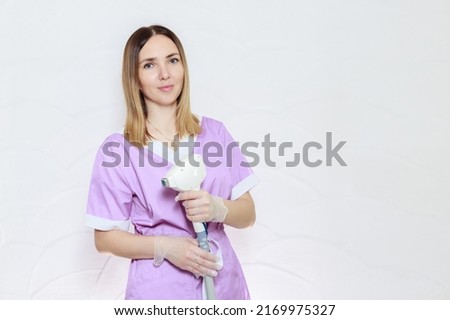 portrait of a beautician with a diode laser. skin hair removal procedure Royalty-Free Stock Photo #2169975327