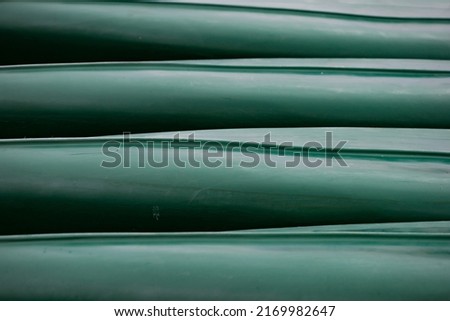 Abstract decorative backdrop in turquoise color. Dirty blue and green lines. Pattern of boats bottom. Geometric background.