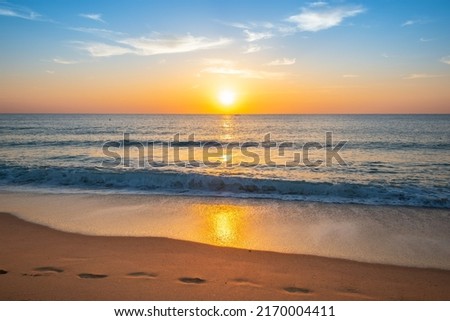 Beautiful sunset on the beach. Royalty-Free Stock Photo #2170004411