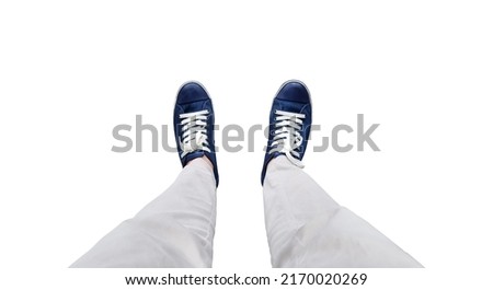 close up, top view of young man wearing denim sneakers and beige pants isolated on background with clipping path. fashion hipster of cool casual business man. Royalty-Free Stock Photo #2170020269