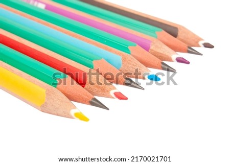 Color pencils mixed with gray pencils isolated on white background
