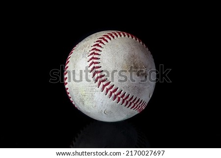Baseball ball on black background. American traditional sports game.  
