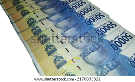Stacks of money neatly arranged. Indonesian currency 50,000 rupiah, financial concept and economic theme.