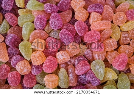 Full frame background of many multicolored gumdrops covered with sugar and placed in heap Royalty-Free Stock Photo #2170034671