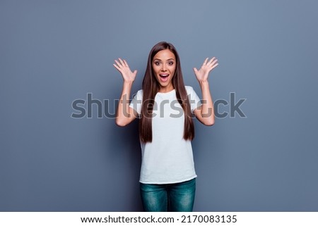Portrait of impressed overjoyed lady raise arms palms open mouth cant believe isolated on grey color background