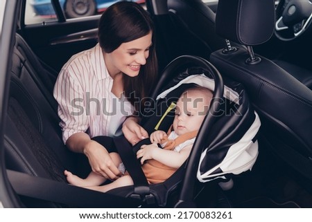 Photo of cheerful positive mom son wear casual outfits sitting transport fasten seatbelt inside vehicle Royalty-Free Stock Photo #2170083261