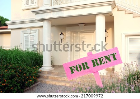 Real estate sign in front of new house for rent