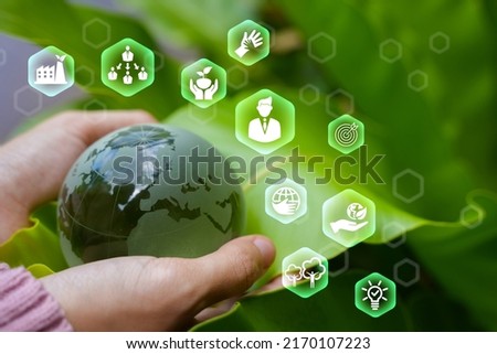 Corporate social responsibility and community giving back CSR icon concept on green nature background. Royalty-Free Stock Photo #2170107223
