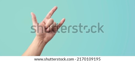 Hand gesturing sign of love and rock Royalty-Free Stock Photo #2170109195