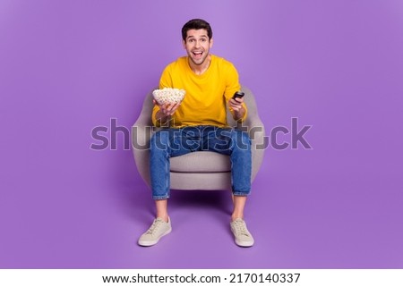 Full size photo of excited cheerful man watch his favorite football team play isolated on violet color background