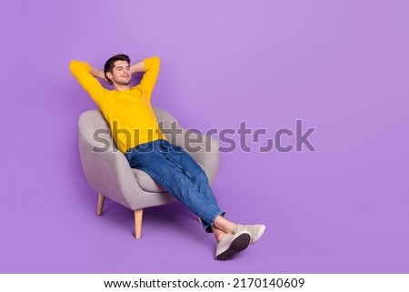 Full size photo of good mood calm peaceful man sit comfy armchair have a nap isolated on violet color background Royalty-Free Stock Photo #2170140609