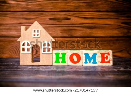 Wooden home and text on the cubes HOME 