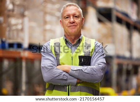 Leave it to the logistical specialist. Portrait of a mature man working in a warehouse. Royalty-Free Stock Photo #2170156457