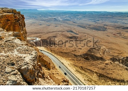 Israel. New highway around the crater. Ramon Crater "Makhtesh Ramon" is an erosion crater in the Negev Desert. The morning after the starfall.  Royalty-Free Stock Photo #2170187257
