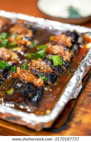 A delicious Chinese dish, teppanyaki eggplant stuffed with meat