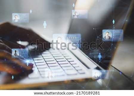 Human resources information system and specialist marketplace with human fingers on laptop keyboard and digital user profile cards with rating, double exposure
