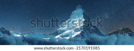 panoramic view to the majestic Matterhorn mountain at night with milky way Royalty-Free Stock Photo #2170191085