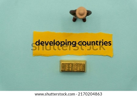 developing countries.The word is written on a slip of paper,on colored background. professional terms of finance, business words, economic phrases. concept of economy. Royalty-Free Stock Photo #2170204863
