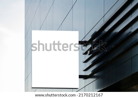 Blank white rectangular mock up street signboard of store, restaurant, office on gray wall outdoors