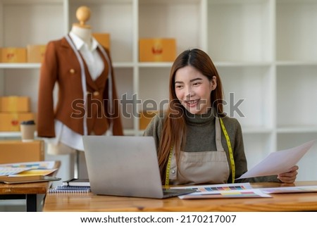asian woman professional fashion designer working in modern office