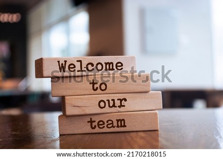 Wooden blocks with words 'Welcome to our team'. Business concept