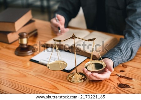 Attorney reading law code, studying constitution to protect human rights closeup, Male lawyer or judge working with Law books, gavel Royalty-Free Stock Photo #2170221165