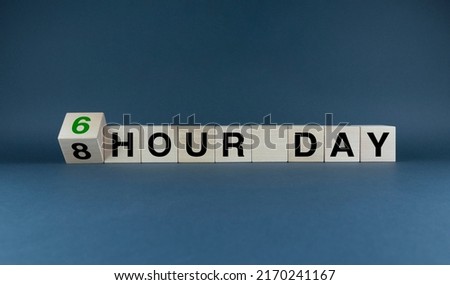 8 hour day or 6 hour day. Cubes form the expression 8 hour day or 6. Concept for a six hour workday Royalty-Free Stock Photo #2170241167