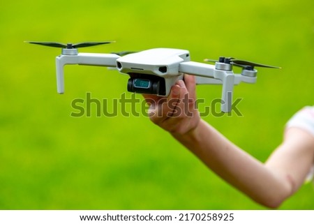 Small drone in hand of child