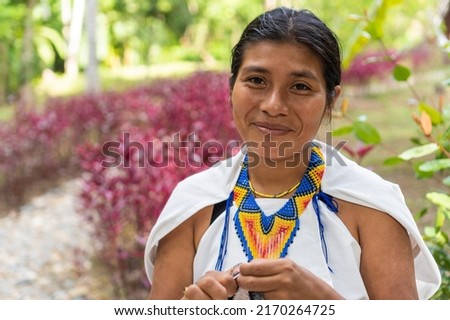 Stock photo of a portrait of a Colombian woman in traditional clothing. Beautiful shot of a young indigenous woman from the Sierra Nevada de Santa Marta, smiling looking at the camera. Royalty-Free Stock Photo #2170264725
