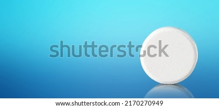 White pill with copy space on blue background