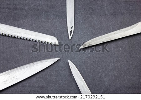 The Blades of knives concept. Sharp steel blades of knives on a dark background. Sharp knives collection. Royalty-Free Stock Photo #2170292151