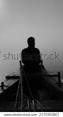 Guy on a boat in the sea