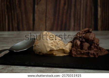 Nougat and chocolate ice cream on a slate plate