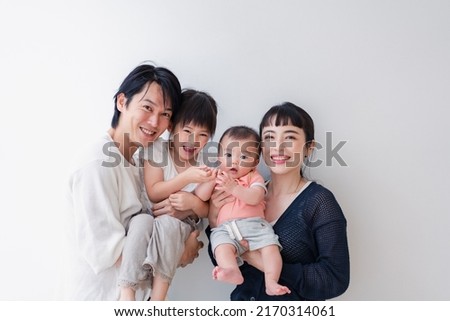 Family with babies in a group photo Royalty-Free Stock Photo #2170314061