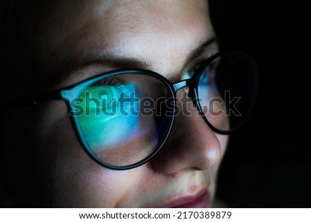 Girl works on internet. Reflection at the glasses from laptop.
Close up of woman's eyes with black female glasses for working at a computer. Eye protection from blue light and rays. Royalty-Free Stock Photo #2170389879