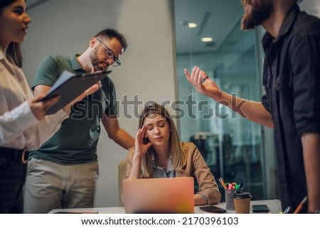 Stressed overwhelmed business colleagues feeling tired at corporate meeting. Business people conflict problem. Stress at work or migraine concept. Solving problem in an office. Royalty-Free Stock Photo #2170396103