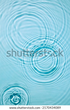 Blue water texture, surface with rings, ripples. Spa concept background Royalty-Free Stock Photo #2170434089