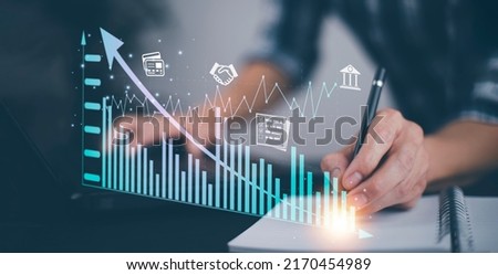 Concept financial transactions online, businessman use laptop with point at financial analyzing data while discussion, planning brand promotion budget, raising company awareness in social media Royalty-Free Stock Photo #2170454989