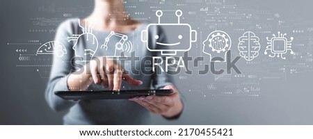 Robotic Process Automation RPA theme with business woman using a tablet computer Royalty-Free Stock Photo #2170455421