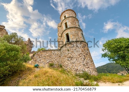 An ancient stone tower at the Chateau de Grimaud or Grimaud Castle, a hilltop fortification above the town of Saint-Tropez in the Provence-Alpes Mediterranean region of France.