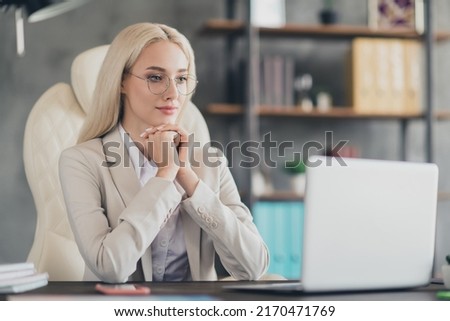 Photo of pretty smiling businesswoman wear blazer chatting modern gadget indoors workplace workstation
