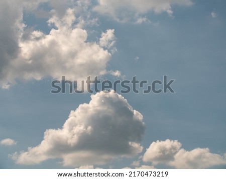 Blue sky with white clouds in the summer. White cirrus and cumulus clouds. Place in the center is  perfect to add text. Royalty-Free Stock Photo #2170473219