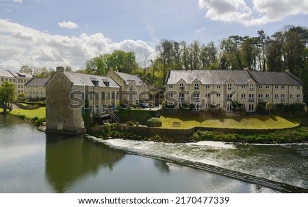 Scenic view of old stone houses on a river in an English town