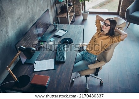 Above high angle view portrait of attractive calm girl resting developing web project remote support at workplace workstation indoors Royalty-Free Stock Photo #2170480337