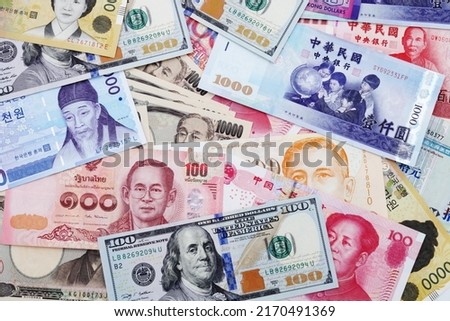 Background of banknotes from different countries. U.S. dollar, Chinese yuan, Japanese yen, Korean won, Thai baht banknotes, etc. Royalty-Free Stock Photo #2170491369