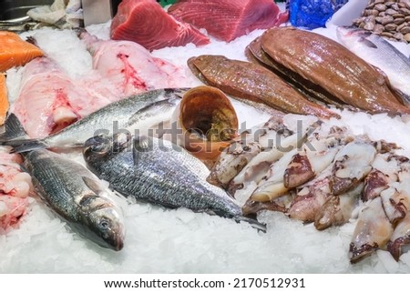 Market stall with fish and seafood seen in Barcelona Royalty-Free Stock Photo #2170512931